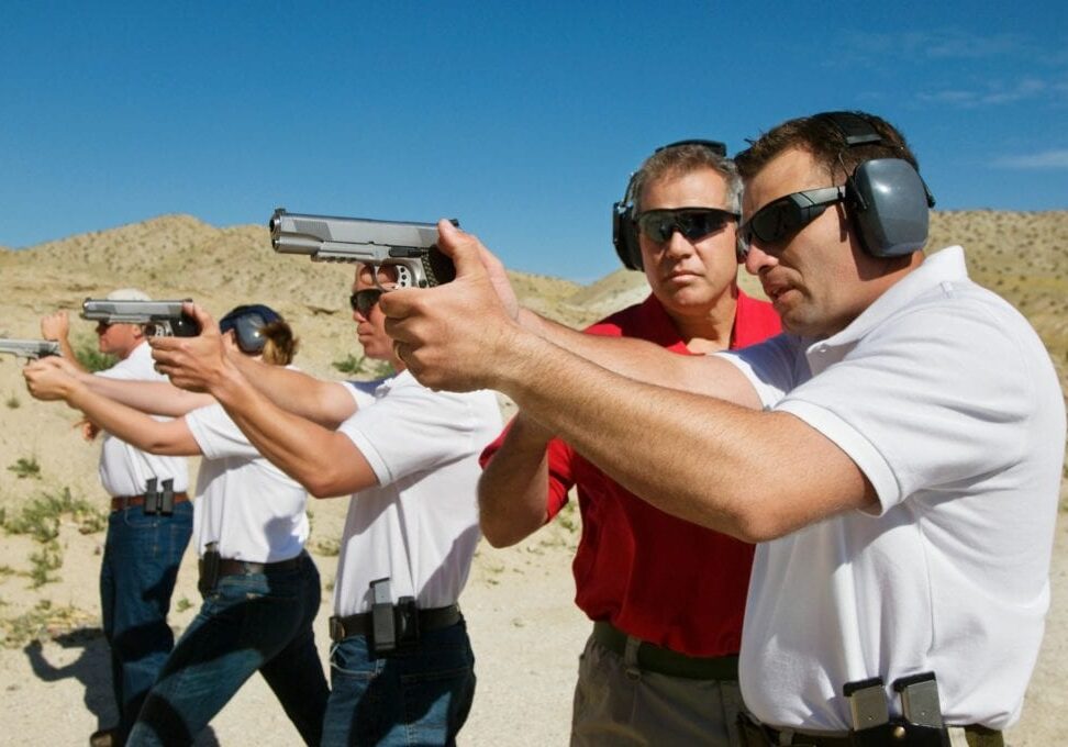 People practicing shooting at a firing range.