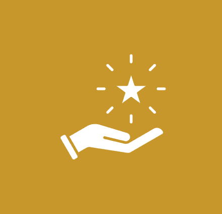 Hand holding a star with sparkles.